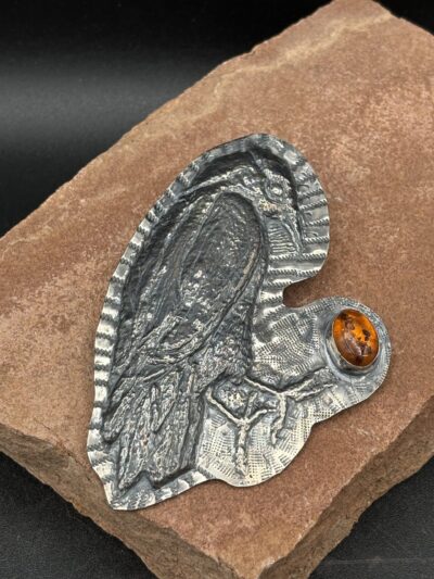Raven Repousse Pin with Amber by Kristine Mills
